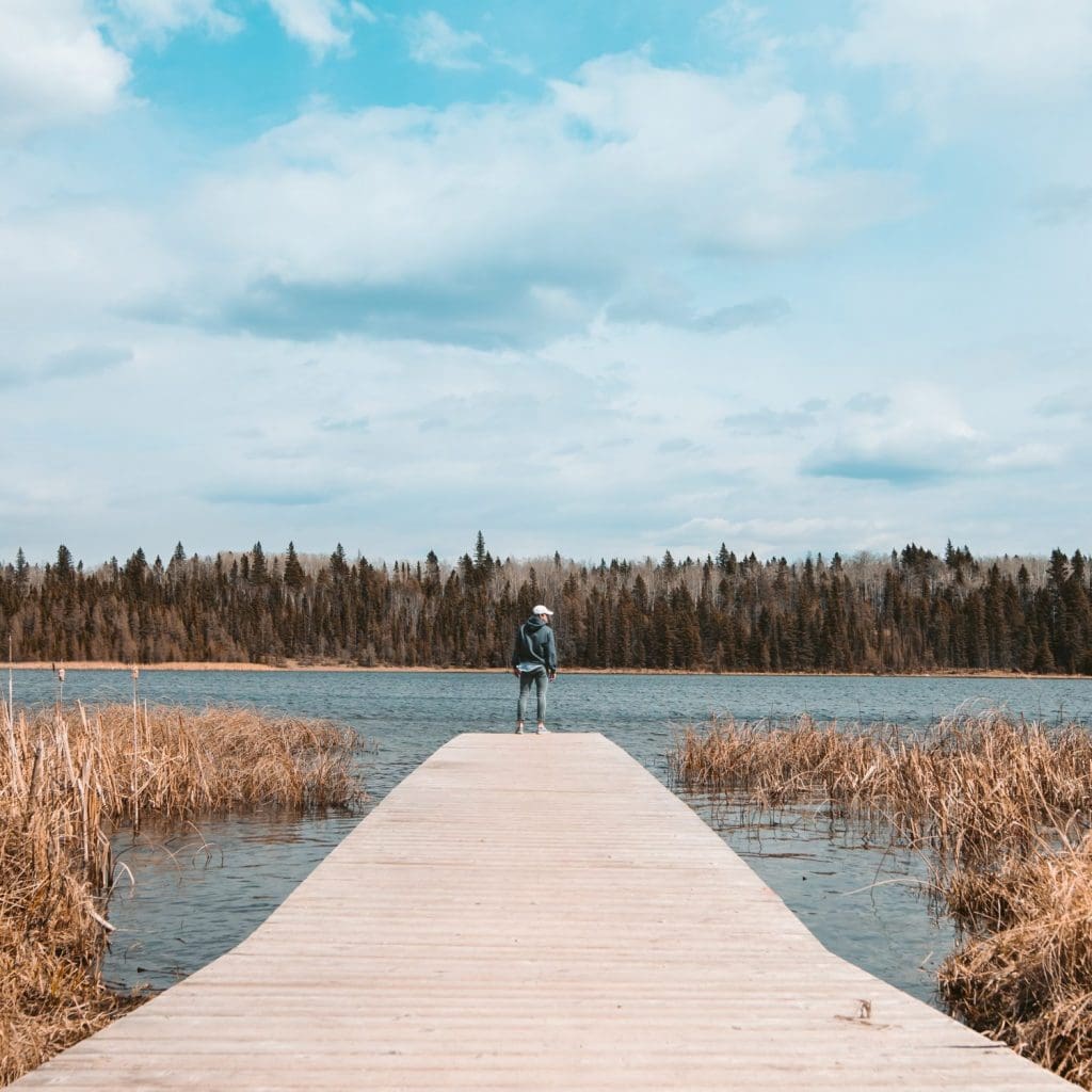 Person standing on a dock at Clear Lake